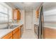 Functional kitchen design with light-colored cabinets and stainless steel appliances at 3623 Thurleston Sw Ct, Marietta, GA 30008