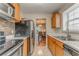 Well-lit kitchen with stainless steel appliances and view into the dining area at 3623 Thurleston Sw Ct, Marietta, GA 30008