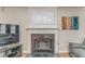Cozy fireplace with elegant white mantel and decorative wall art at 3623 Thurleston Sw Ct, Marietta, GA 30008