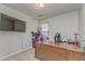 Home office features natural light, built in desk and television at 3623 Thurleston Sw Ct, Marietta, GA 30008