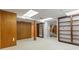 Spacious basement featuring built-in bookshelves and ample natural light from the doorway at 431 Keeler Woods Nw Dr, Marietta, GA 30064