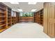 Bright basement with built-in bookshelves and a large window offering backyard views at 431 Keeler Woods Nw Dr, Marietta, GA 30064