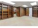 Finished basement features wood built-in shelves and storage at 431 Keeler Woods Nw Dr, Marietta, GA 30064