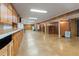 Finished basement area with vinyl tile flooring, cabinets, and utility access at 431 Keeler Woods Nw Dr, Marietta, GA 30064