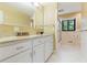 Bright bathroom featuring a granite countertop and a large vanity at 431 Keeler Woods Nw Dr, Marietta, GA 30064