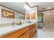 Bathroom vanity with double sinks, granite counters, and a glass-enclosed shower at 431 Keeler Woods Nw Dr, Marietta, GA 30064