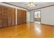 Bedroom with hardwood floors, a ceiling fan, and large closet space at 431 Keeler Woods Nw Dr, Marietta, GA 30064