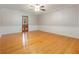 Bright dining room featuring hardwood floors, decorative wall trim, and neutral wallpaper at 431 Keeler Woods Nw Dr, Marietta, GA 30064