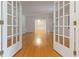 View through glass paneled French doors into living room featuring hardwood floors at 431 Keeler Woods Nw Dr, Marietta, GA 30064