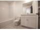 Bathroom with white vanity, toilet, and tiled shower/tub featuring modern fixtures and bright, clean design at 548 Sawnee Village Blvd # D54, Cumming, GA 30040