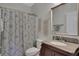 Classic bathroom with a granite vanity and patterned shower curtain creates a harmonious and inviting atmosphere at 792 Mimosa Se Dr, Marietta, GA 30060