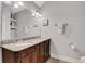 Bathroom vanity with granite countertop and double sinks offers ample space and classic appeal at 792 Mimosa Se Dr, Marietta, GA 30060