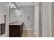 Bright bathroom with a double sink vanity, granite counters, and a tiled floor, complemented by modern lighting at 792 Mimosa Se Dr, Marietta, GA 30060