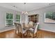Dining room boasts natural light with wooden flooring, and neutral color scheme at 792 Mimosa Se Dr, Marietta, GA 30060
