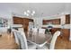 Dining room features hard wood floors, chandelier lighting and wooden cabinets at 792 Mimosa Se Dr, Marietta, GA 30060