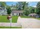 Attractive home with a green front lawn and established landscaping at 792 Mimosa Se Dr, Marietta, GA 30060