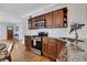 Kitchen features stainless appliances, subway tile backsplash, granite countertops, and wood cabinets at 792 Mimosa Se Dr, Marietta, GA 30060