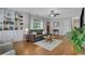 Welcoming living room boasts hardwood floors, built-in shelves, and ample natural light at 792 Mimosa Se Dr, Marietta, GA 30060