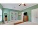 The bedroom boasts access to the exterior with neutral tones, soft carpet, and a ceiling fan at 792 Mimosa Se Dr, Marietta, GA 30060