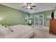 Spacious bedroom with French doors, ceiling fan, and neutral carpet at 792 Mimosa Se Dr, Marietta, GA 30060