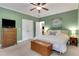 Bedroom with neutral walls, a ceiling fan, double closets and soft carpet at 792 Mimosa Se Dr, Marietta, GA 30060