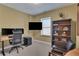 Home office with a sleek desk setup, a comfortable chair, and a built-in bookshelf, perfect for productivity at 792 Mimosa Se Dr, Marietta, GA 30060