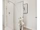 Bathroom featuring a glass door shower and a shower caddy on the wall at 12086 Conrad Cir, Hampton, GA 30228