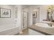 Bathroom with dual sinks, stone countertops, and a glass door shower at 12086 Conrad Cir, Hampton, GA 30228