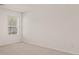 Carpeted room with a window and electrical outlets is ready for move in at 12086 Conrad Cir, Hampton, GA 30228