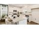 Bright kitchen featuring white cabinets, stainless steel appliances, granite countertops, and an island at 12086 Conrad Cir, Hampton, GA 30228