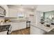 Modern kitchen with granite countertops, stainless steel appliances, and an island with bar seating at 12086 Conrad Cir, Hampton, GA 30228