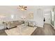 Cozy living room featuring a comfortable sofa, chairs, and a rug at 12086 Conrad Cir, Hampton, GA 30228