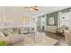 Inviting living room featuring neutral decor and natural light, creating a warm and comfortable atmosphere at 12086 Conrad Cir, Hampton, GA 30228