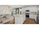 Open concept living space featuring a modern kitchen and living room at 12086 Conrad Cir, Hampton, GA 30228