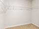 Spacious walk-in closet with ample storage shelves, providing an organized space for clothing and accessories at 12086 Conrad Cir, Hampton, GA 30228