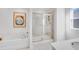 Clean bathroom with a soaking tub, glass shower, and sleek vanity offers a spa-like experience at 1405 Windance Lake Dr, Loganville, GA 30052