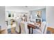 Open-concept dining room with modern decor, stylish furniture, and natural light, seamlessly connecting living spaces at 1405 Windance Lake Dr, Loganville, GA 30052