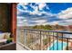 Cozy balcony with wicker furniture overlooking a beautiful pool and green landscape at 1820 Peachtree Nw St # 811, Atlanta, GA 30309