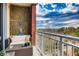 Cozy balcony with comfortable seating and views of trees, sky, and surrounding landscape, ideal for relaxing outdoors at 1820 Peachtree Nw St # 811, Atlanta, GA 30309