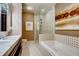 Spa-like bathroom with double sinks, tub and separate shower, and modern finishes at 1820 Peachtree Nw St # 811, Atlanta, GA 30309