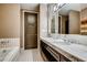 Elegant bathroom with marble countertop, bath, and a modern design at 1820 Peachtree Nw St # 811, Atlanta, GA 30309