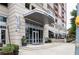 Inviting building entrance with a covered entryway and manicured landscaping at 1820 Peachtree Nw St # 811, Atlanta, GA 30309
