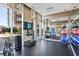Spacious gym with free weights, a mirror, and a television at 1820 Peachtree Nw St # 811, Atlanta, GA 30309