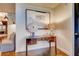Stylish hallway area with a dark wood desk and unique lamps on hardwood floors at 1820 Peachtree Nw St # 811, Atlanta, GA 30309