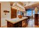 Spacious kitchen island with granite countertops, wine storage, and stainless microwave at 1820 Peachtree Nw St # 811, Atlanta, GA 30309