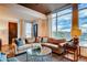 Cozy living room featuring comfortable sofa, lots of natural light and city views at 1820 Peachtree Nw St # 811, Atlanta, GA 30309