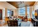 Bright living room featuring comfortable seating, large windows, and a stylish rug at 1820 Peachtree Nw St # 811, Atlanta, GA 30309