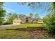 Spacious home featuring a well-kept lawn, double garage, and covered front porch at 4050 Old Fairburn Rd, Atlanta, GA 30349