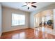 Comfortable living room with hardwood flooring, ceiling fan, and natural light provides an airy and welcoming space at 4050 Old Fairburn Rd, Atlanta, GA 30349