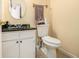 Bathroom featuring a pedestal sink, round mirror and ceramic tiled floors at 6433 Stone Terrace Ter, Morrow, GA 30260